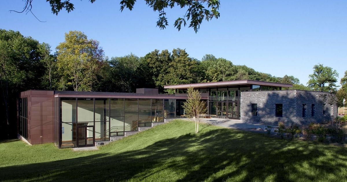 Vollmer Center After Solar Bird Safety Window Film Installation Vollmer Visitor and Education Center at Cylburn Arboretum showing floor-to-ceiling glass windows with solar bird safety window film installation