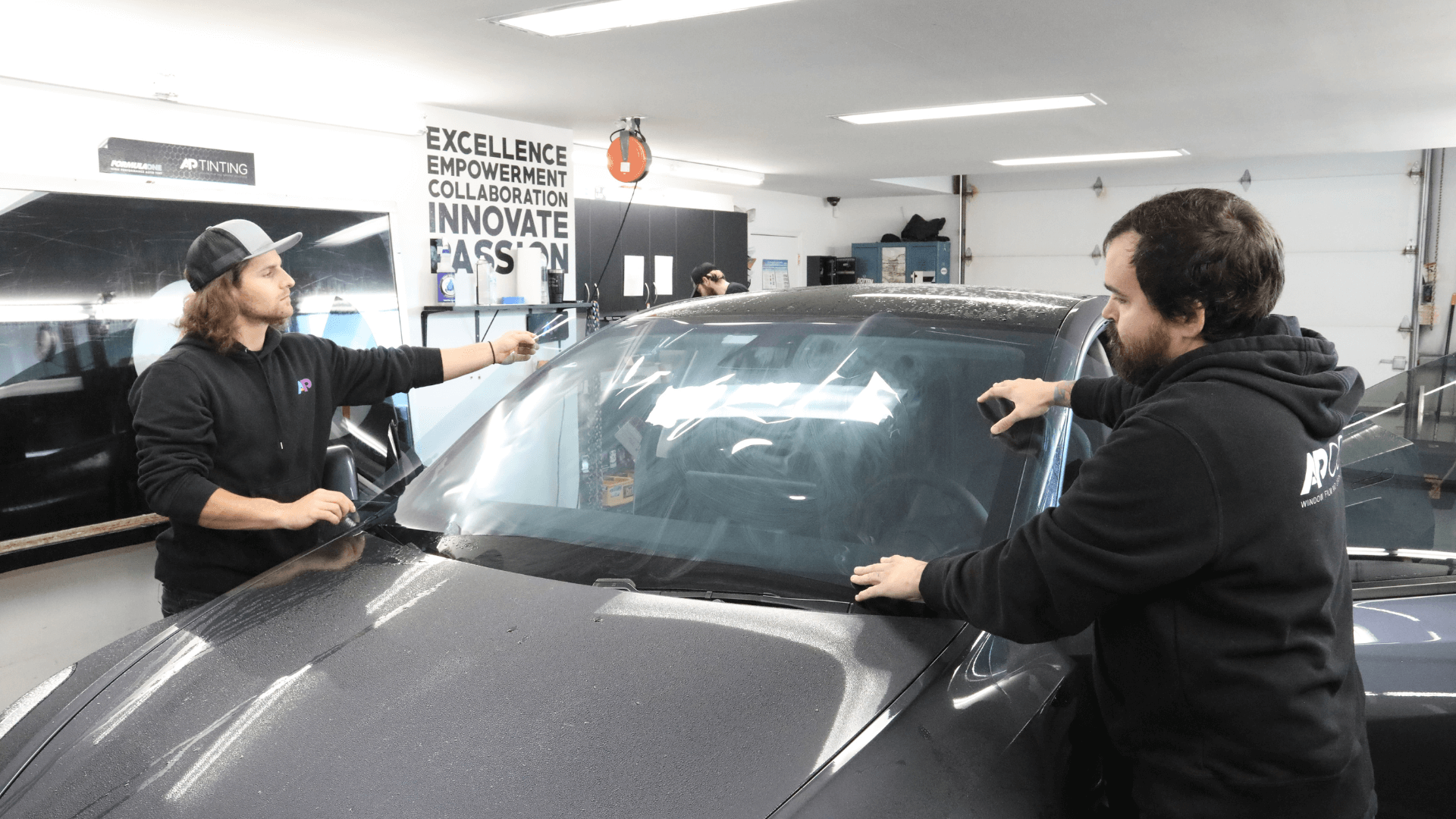 ap tinting installers working on tesla window tint