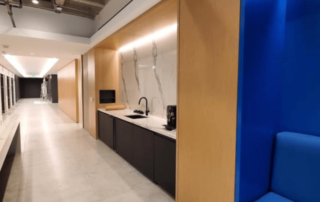 lobby with marble look call and light wood architectural finish to add style
