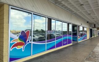 Colorful custom-printed window graphics seamlessly span several windows.