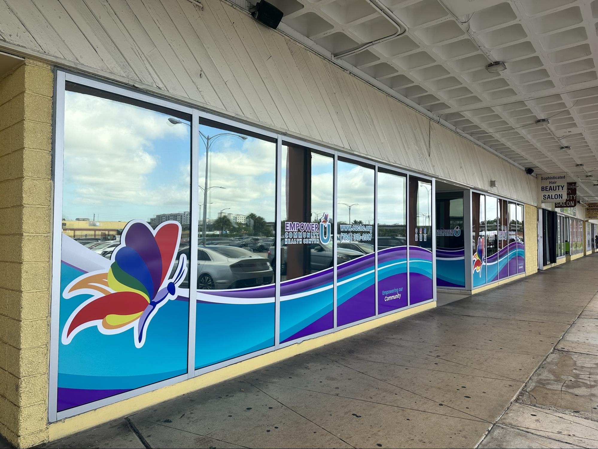 Colorful custom-printed window graphics seamlessly span several windows.