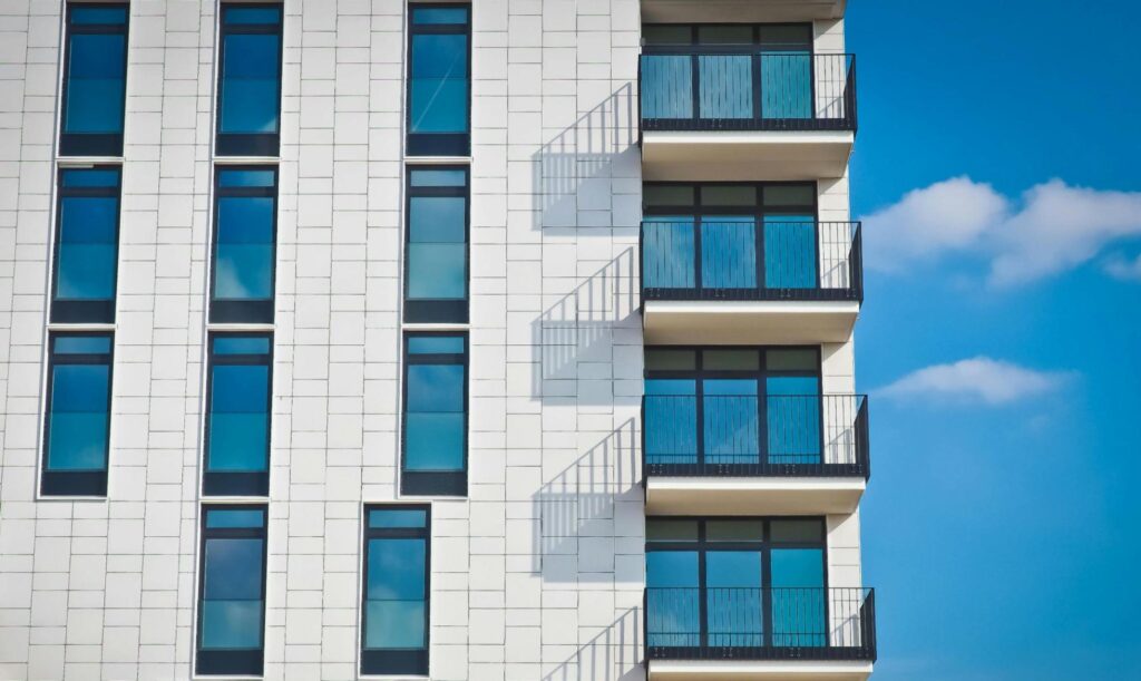 High Rise Apartment Building with Windows and Balconies