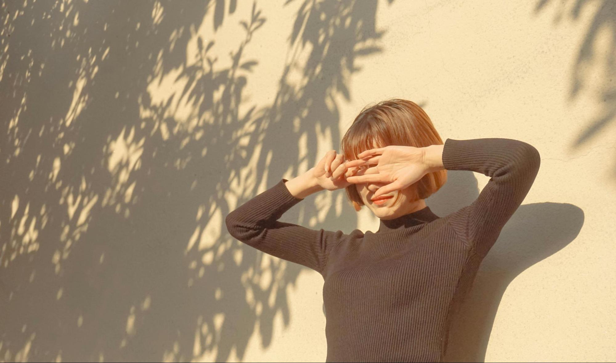 Woman Standing in the Sunlight