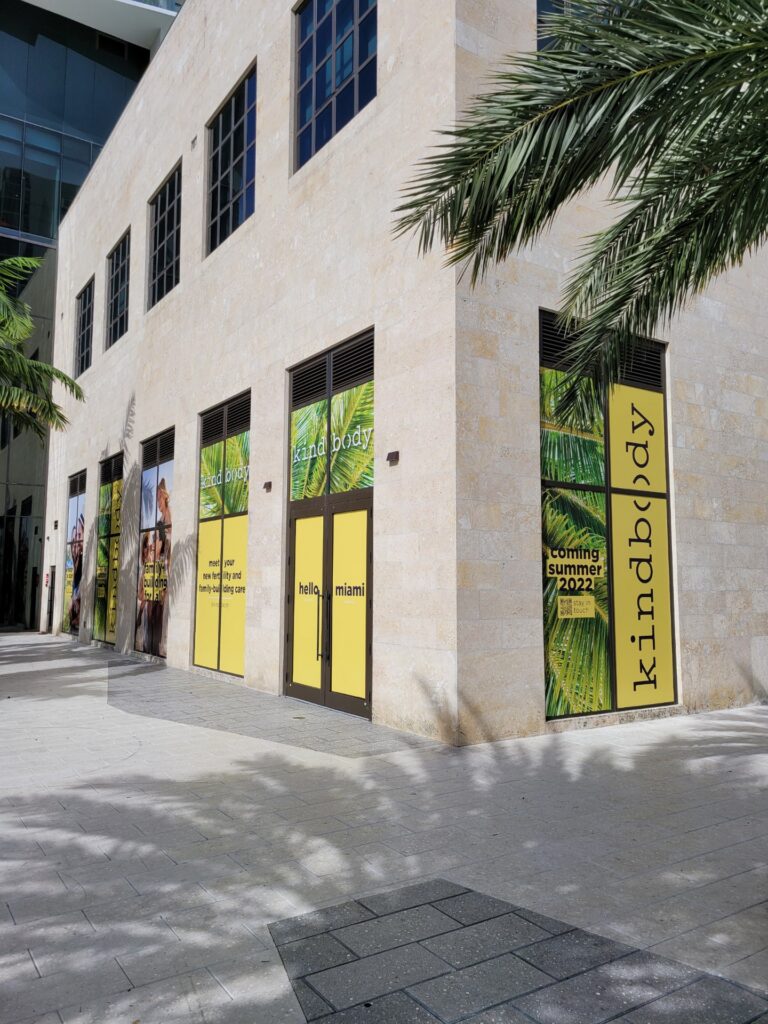 A storefront with vivid custom window film applied.