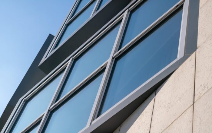 Close-up view of commercial building windows with tinted films.