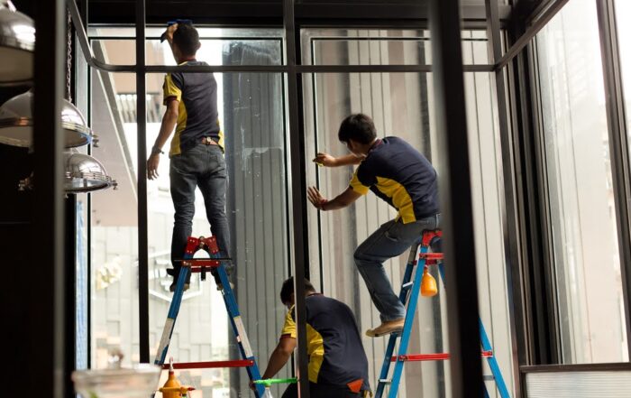 Home window tint being installed by trained professionals.